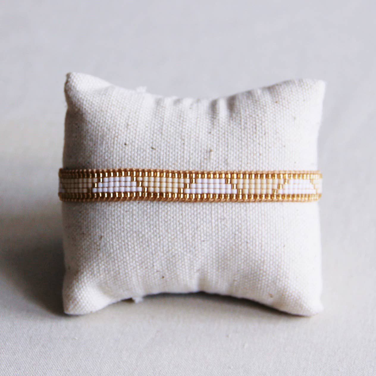 Pulsera tejido blanco/champán/oro