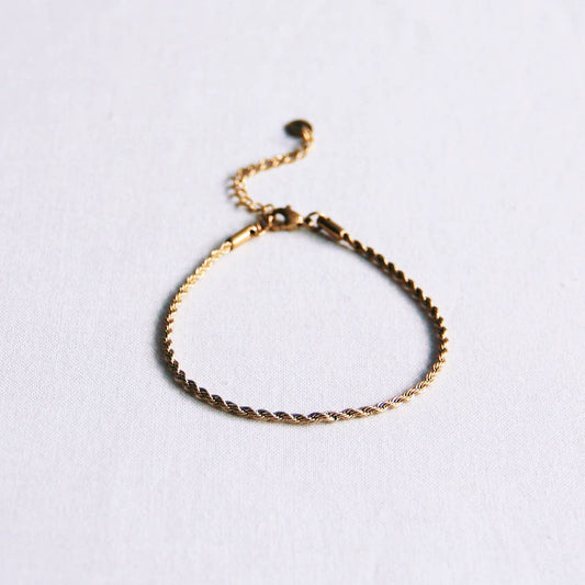 PULSERA PEQUEÑA "TORCIDA" ACERO - DORADO