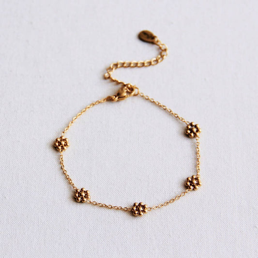 Pulsera fina de flores de margarita de acero inoxidable - dorado