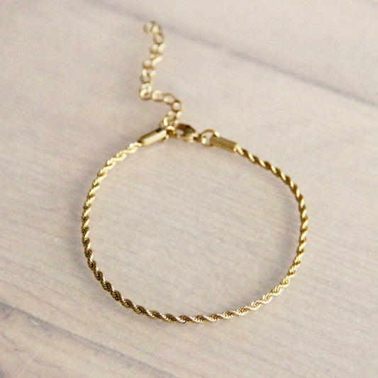Pulsera pequeña «torcida» de acero — oro